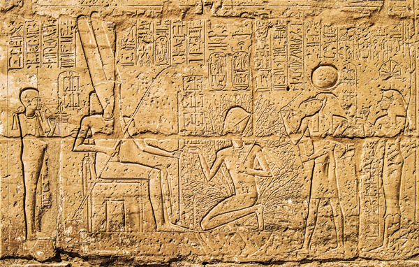 Seti I kneeling under the scared tree