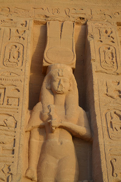 Statue of Queen Nefertari in front of her temple