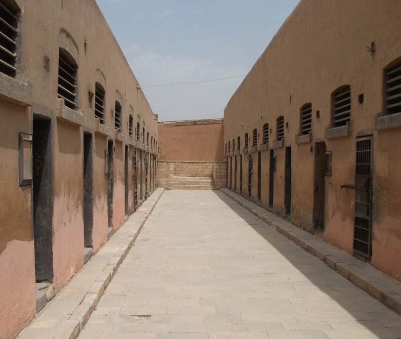 The internal corridor between the cells