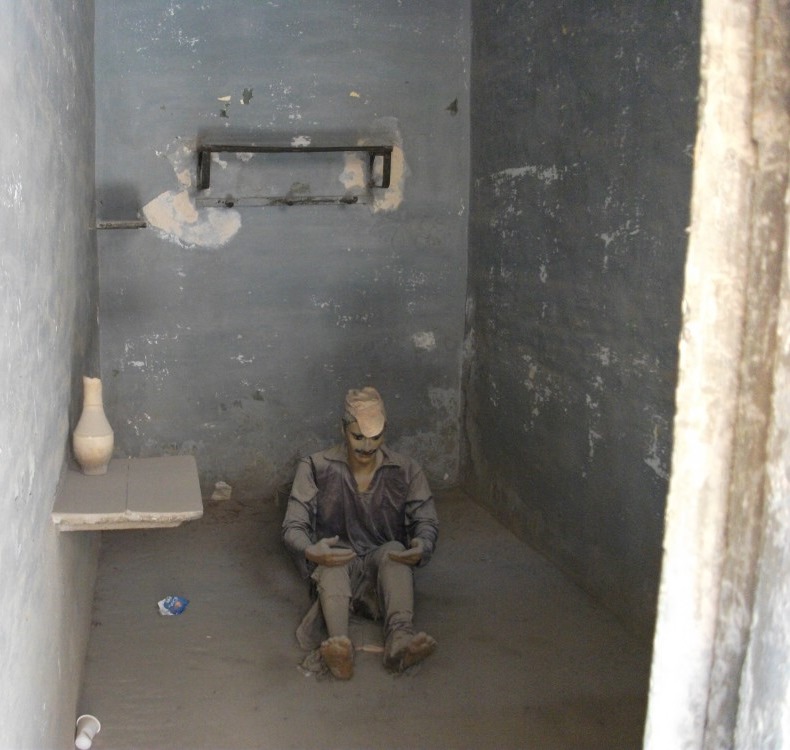 A model of a prisoner wearing their assigned uni