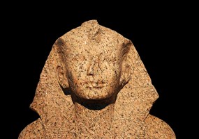 The upper part of a royal statue