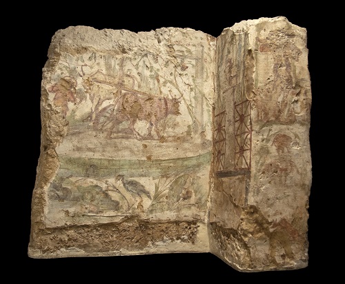 A plaster piece depicting an agricultural scene