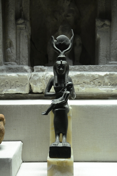 A statue of Isis , nursing the baby Horus