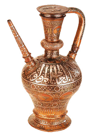 A jug of copper inlaid with gold and silver